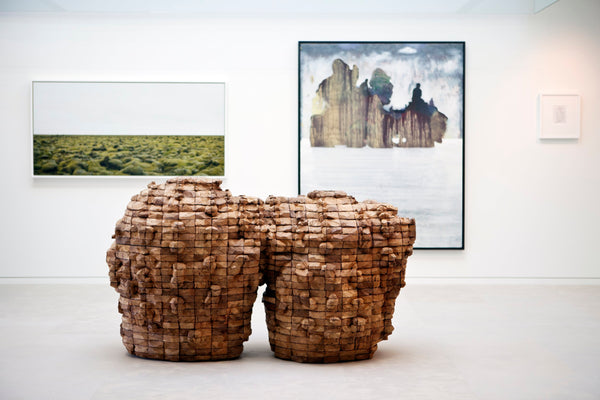 How to Curate Art for Healing Spaces by Jaime Kowal photo of art gallery with hanging art and sculptures